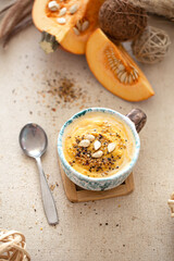 Delicious composition with pumpkin soup, top view.