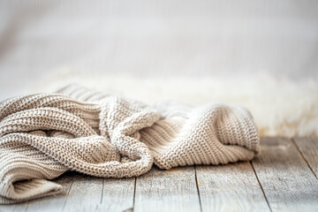 Background with a cozy knitted sweater, space for text.