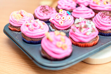 Creative pink cupcakes on plate