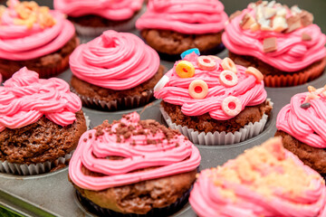 Creative pink cupcakes on plate