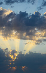 Fototapeta na wymiar clouds and sunstrikes in sardinia, italy