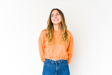 Obraz premium Young caucasian woman isolated on white background relaxed and happy laughing, neck stretched showing teeth.