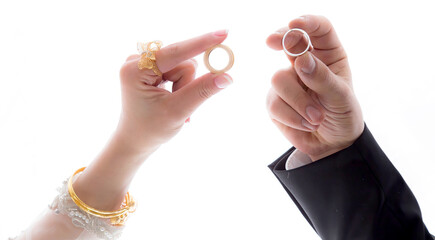 Woman and man holding wedding rings, close-up,
