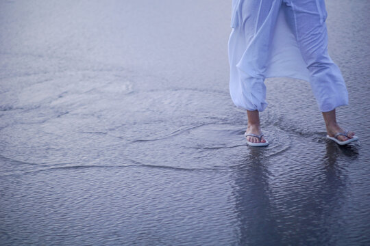 Woman walking on the beach
