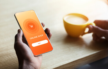 Person using phone with online store website on screen