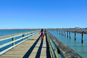 The MarshWalk, located in the heart of the historic fishing village of Murrells Inlet is a &frac12; mile wooden boardwalk along a natural saltwater estuary, Georgetown County, South Carolina. 