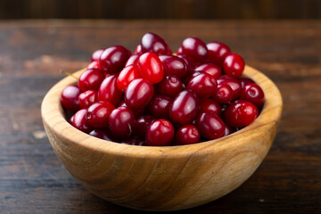 Dogwood berries in a wooden bowl