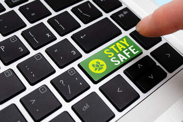 Writing note showing Stay Safe. Business concept for secure from threat of danger, harm or place to...