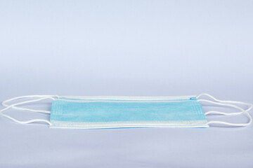 Protective face mask on white background, Medical surgical face mask for coronavirus disease (COVID-19) prevention.