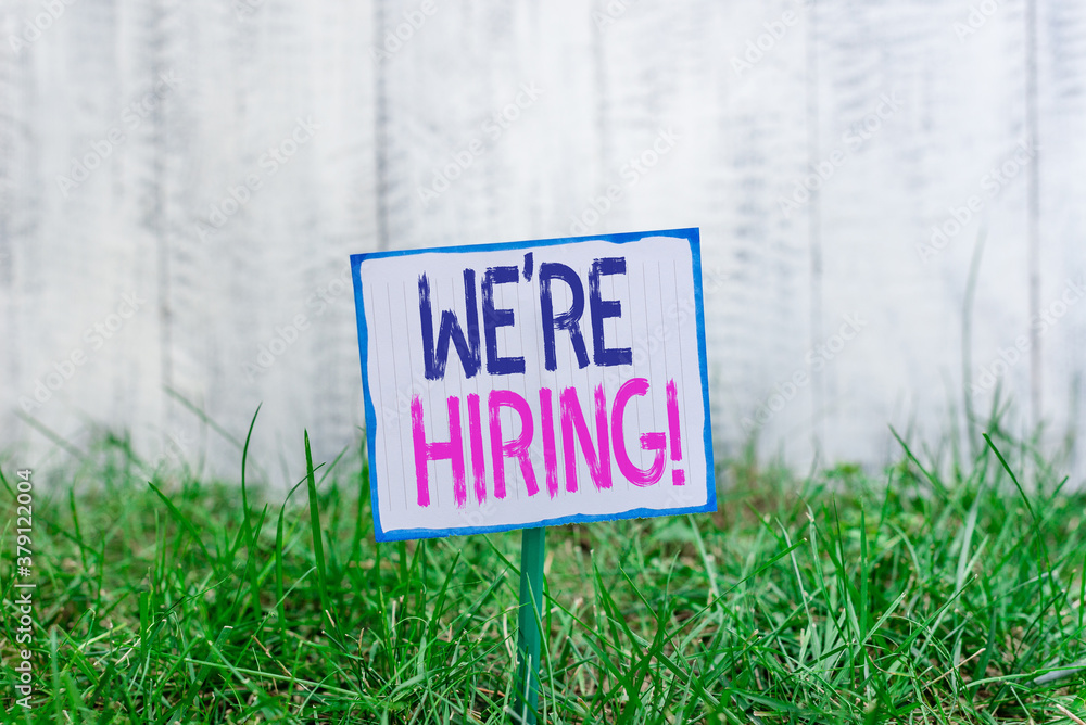 Poster handwriting text we re hiring. conceptual photo process of reviewing applications and finding candid
