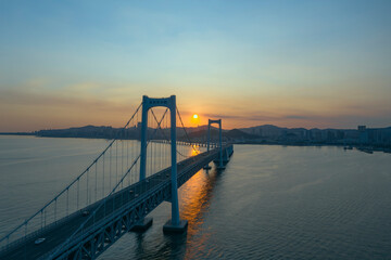 Aerial photo of the cross sea bridge at sunset was taken in Dalian, Liaoning Province, China © yue