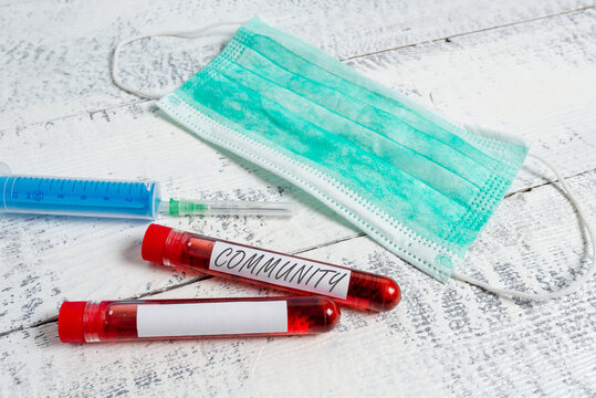 Text sign showing Community. Business photo showcasing group of showing with a common characteristics living together Extracted blood sample vial with medical accessories ready for examination