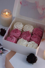 pink and white marshmallow with candles