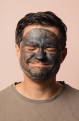 funny guy with a cosmetic mask on his face
