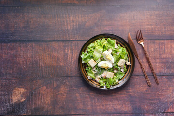 top view of greek salad in a plate on table.