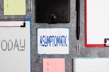Word writing text Asymptomatic. Business photo showcasing a condition or an individual producing or...
