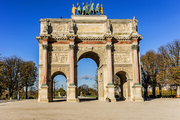 Fototapeta na wymiar Triumphal Arch (Arc de Triomphe du Carrousel) at Tuileries gardens in Paris, France. Monument built in 1806 - 1808 to commemorate Napoleon's military victories.