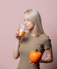 Blonde woman with pumpkin juice