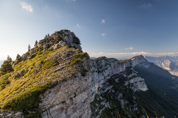 sunset on mountains with grass and trees