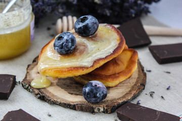 Pancakes with honey and berries. blueberry pie with blueberries. Pancakes with chocolate and berries