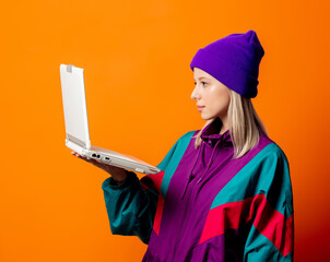 Style woman in 90s tracksuit with notebook