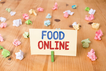 Conceptual hand writing showing Food Online. Concept meaning the practice of taking action to...