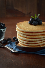 closeup breakfast blueberry pancakes with a fork