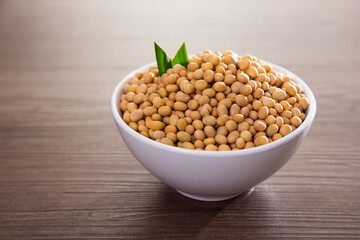 Soy bean on wooden surface. Healthy raw food
