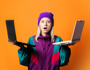 Style woman in 90s tracksuit with two notebooks