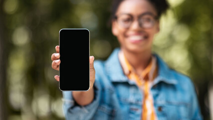 African Female Student Showing Smartphone Screen Standing In Park, Panorama