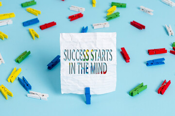 Writing note showing Success Starts In The Mind. Business concept for set your mind to positivity it can go a long way Colored clothespin papers empty reminder blue floor officepin