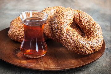 Turkish bagel simit and tea  in glass cup
