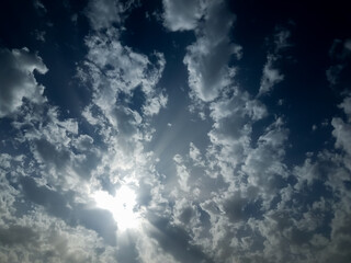 bright sun among well shaped clouds
