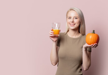 Blonde woman with pumpkin juice