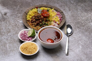 Aloo/Kanda Poha or Tarri Pohe with spicy chana masala/curry. Served in paper plate.