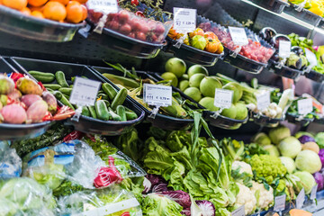 Fototapeta na wymiar Fresh vegetables and fruits put up for sale in supermarket