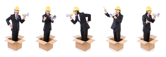Man with hardhat and loudspeaker standing in the box