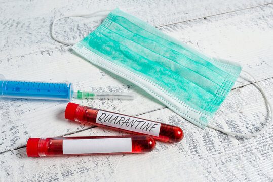 Text Sign Showing Quarantine. Business Photo Showcasing Restraint Upon The Activities Of An Individual Or The Transport Of Goods Extracted Blood Sample Vial With Medical Accessories Ready For