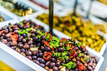 Assorted olives put up for sale on the italian street stall
