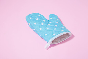 Oven glove on isolated pink background