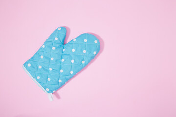 Oven glove on isolated pink background