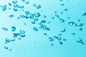 Fototapeta na wymiar Air bubble and water splash,Water splash isolated on blue background.