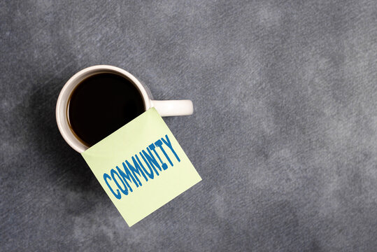 Word writing text Community. Business photo showcasing group of showing with a common characteristics living together Paper accesories with digital smartphone arranged on different background