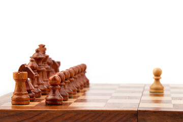 wooden chessboard with pieces and pawns in light and dark brown tones, isolate on a white background