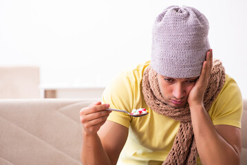 Young man suffering at home