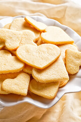 heart shaped sugar cookies on a cake stand