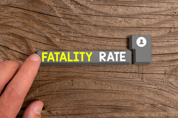 Conceptual hand writing showing Fatality Rate. Concept meaning calculated number of deaths over a...