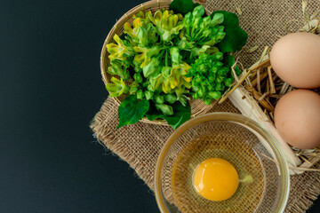 top view on composition space with food preparing for cow slip creeper flower and eggs menu 