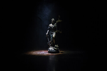 The Statue of Justice - lady justice or Iustitia / Justitia the Roman goddess of Justice on a dark...
