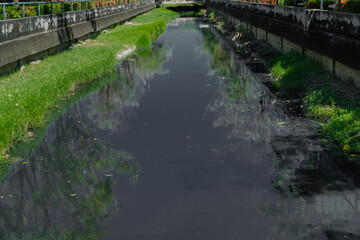 Fototapeta na wymiar Waste water, sewage in the canal